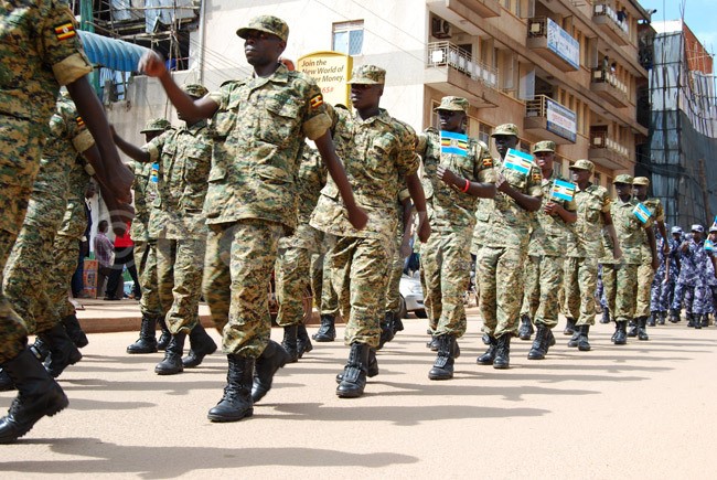 Uganda People’s Defense Forces (UPDF) members marching along the streets of Kampala during the celebration of the East African Community Week on December 04, 2015. (Photo by /Godiver Asege) 